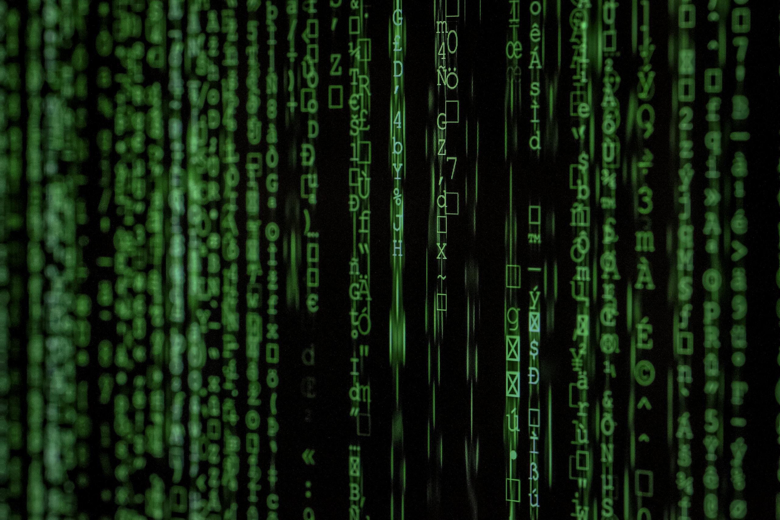 Abstract green matrix code binary data for analysis.